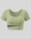 TrackLine Synergy Cropped Tee in Bean Green with Dark Gray color-block panel, 3D front view