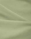 Close-up of smooth stretch fabric on TrackLine Synergy Cropped Tee in Bean Green