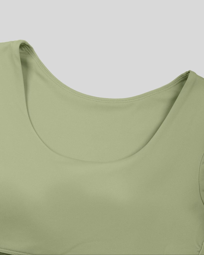 Close-up of U-neckline on TrackLine Synergy Cropped Tee in Bean Green