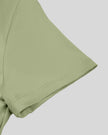 Close-up of short sleeve on TrackLine Synergy Cropped Tee in Bean Green