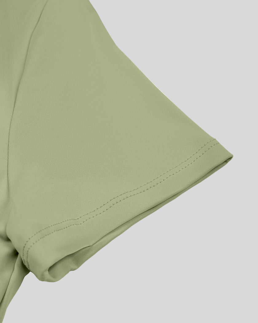 Close-up of short sleeve on TrackLine Synergy Cropped Tee in Bean Green