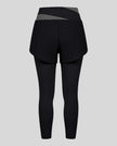 TrackLine Synergy Layered Leggings in black with dark gray crossover waistband and overlay shorts back view