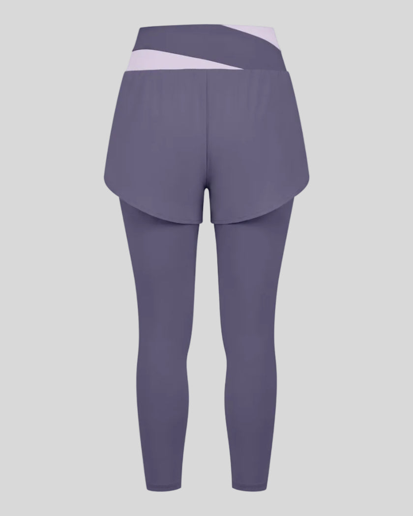 TrackLine Synergy Layered Leggings in deep purple with light purple crossover waistband and overlay shorts back view