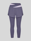 TrackLine Synergy Layered Leggings in deep purple with light purple crossover waistband and overlay shorts front view