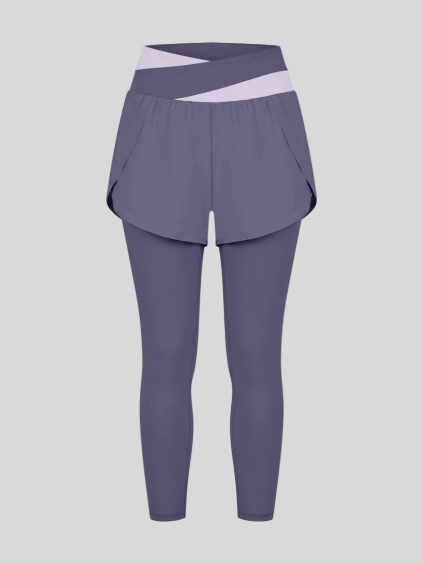 TrackLine Synergy Layered Leggings in deep purple with light purple crossover waistband and overlay shorts front view
