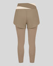 TrackLine Synergy Layered Leggings in light coffee with apricot crossover waistband and overlay shorts back view