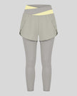 TrackLine Synergy Layered Leggings in light gray with light yellow crossover waistband and overlay shorts front view
