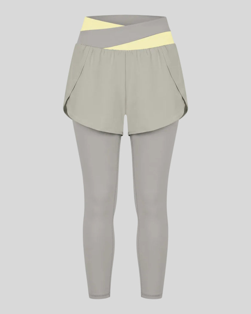 TrackLine Synergy Layered Leggings in light gray with light yellow crossover waistband and overlay shorts front view