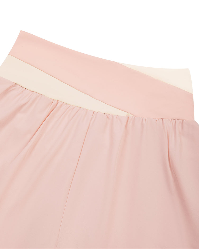 Closeup of back waistband on TrackLine Synergy Layered Leggings in light pink and apricot
