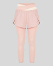 TrackLine Synergy Layered Leggings in light pink with apricot crossover waistband and overlay shorts front view