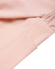 Closeup of side pocket detail on TrackLine Synergy Layered Leggings in light pink