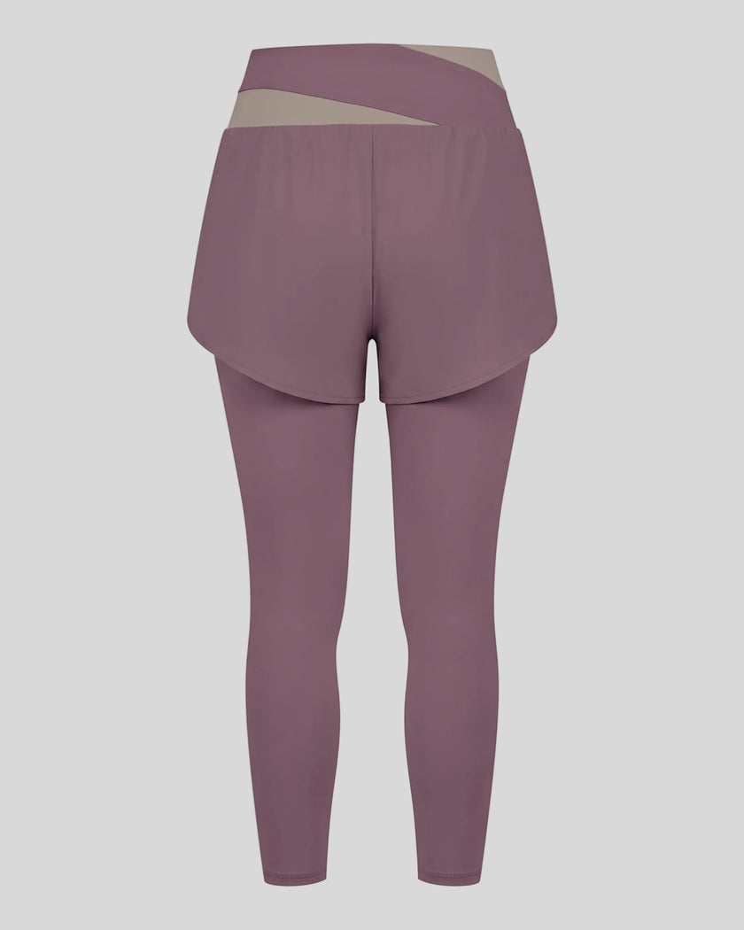 TrackLine Synergy Layered Leggings in misty purple with gray purple crossover waistband and overlay shorts back view