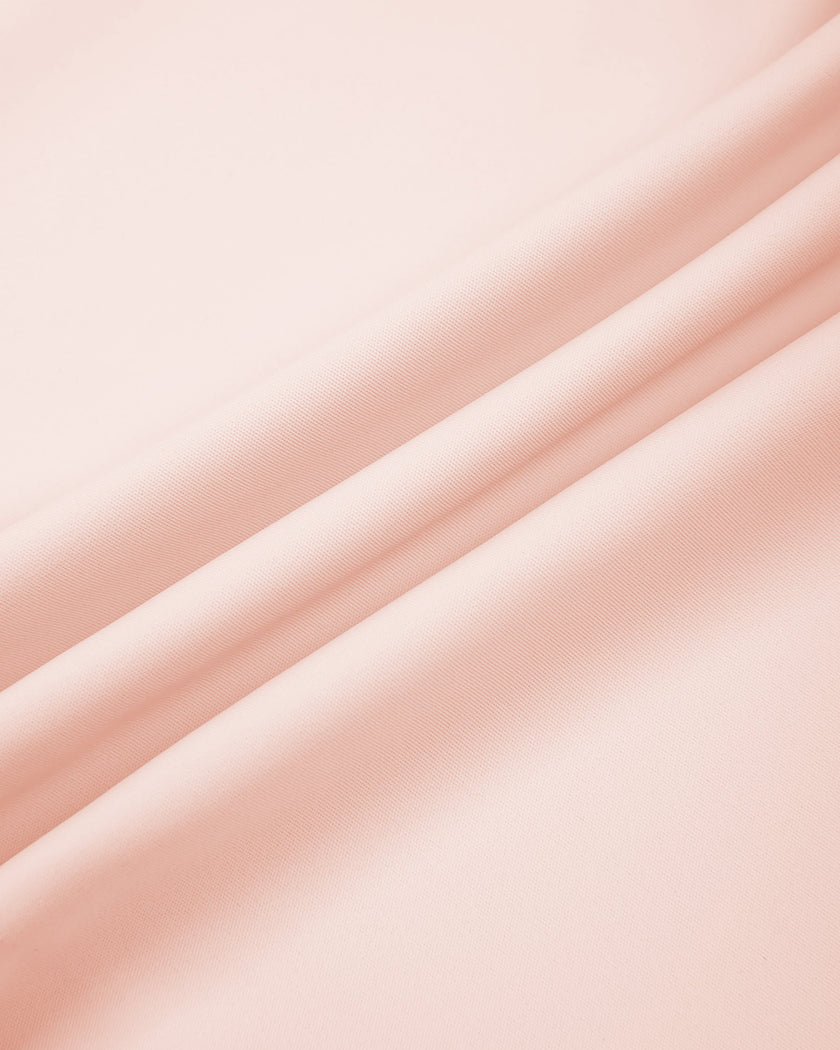 Close-up of smooth stretch fabric on TrackLine Synergy Leggings in Light Pink