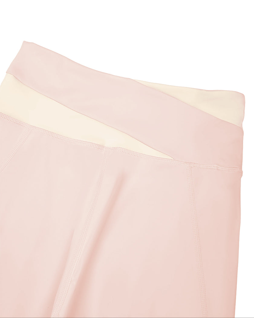 Close-up of color-block back waistband on TrackLine Synergy Leggings in Light Pink and Apricot