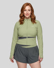 Woman wearing TrackLine Synergy Performance Jacket in Green Bean with Dark Gray panel, front view