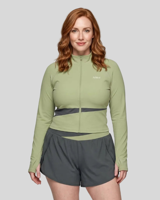 Woman wearing TrackLine Synergy Performance Jacket in Green Bean with Dark Gray panel, front view