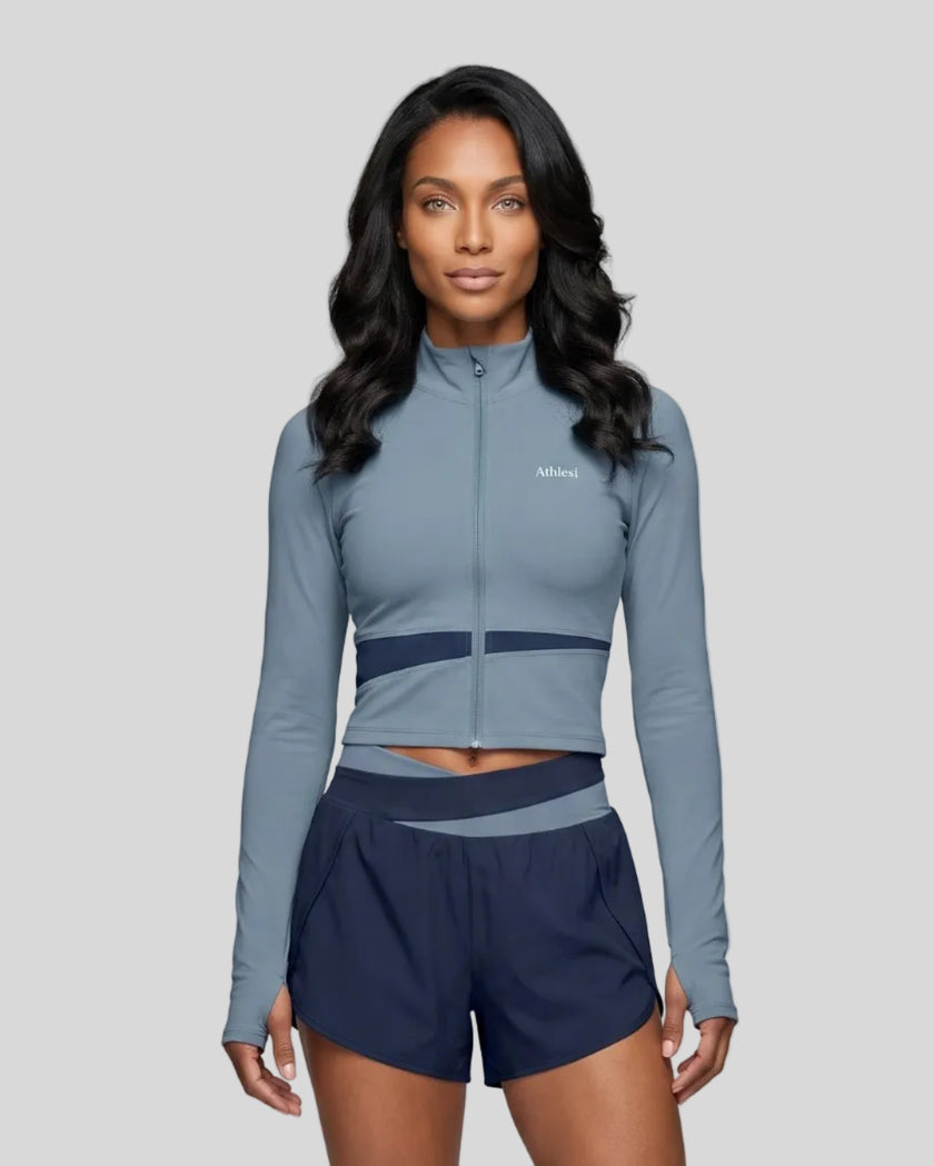 Woman wearing TrackLine Synergy Performance Jacket in Gray Blue with Navy Blue panel, front view
