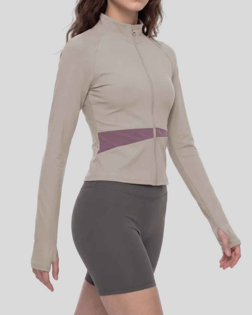 Woman wearing TrackLine Synergy Performance Jacket in Gray Purple with Misty Purple panel, mid body front angle view