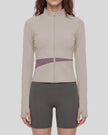 Woman wearing TrackLine Synergy Performance Jacket in Gray Purple with Misty Purple panel, mid body front view