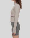 Woman wearing TrackLine Synergy Performance Jacket in Gray Purple with Misty Purple panel, mid body side view