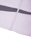 Close-up of fitted hem, front zipper and Deep Purple color-block panel on TrackLine Synergy Performance Jacket