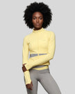 Woman wearing TrackLine Synergy Performance Jacket in Light Yellow with Light Gray panel, front view