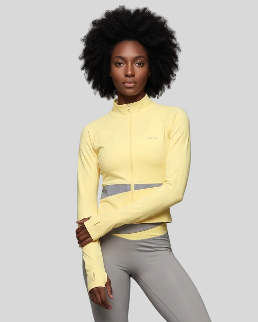 Woman wearing TrackLine Synergy Performance Jacket in Light Yellow with Light Gray panel, front view