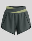 TrackLine Synergy Performance Shorts in Dark Gray with Green Bean color-block waistband, front view