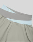 Close-up of crossover color-block waistband on TrackLine Synergy Performance Shorts in Light Gray and Light Blue