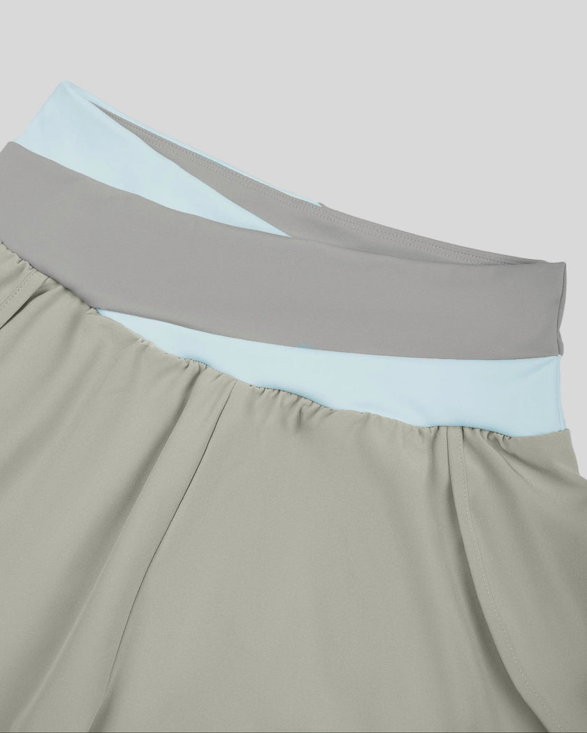 Close-up of crossover color-block waistband on TrackLine Synergy Performance Shorts in Light Gray and Light Blue