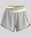 TrackLine Synergy Performance Shorts in Light Gray with Light Yellow color-block waistband, front view