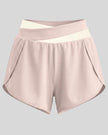 TrackLine Synergy Performance Shorts in Light Pink with Apricot color-block waistband, front view