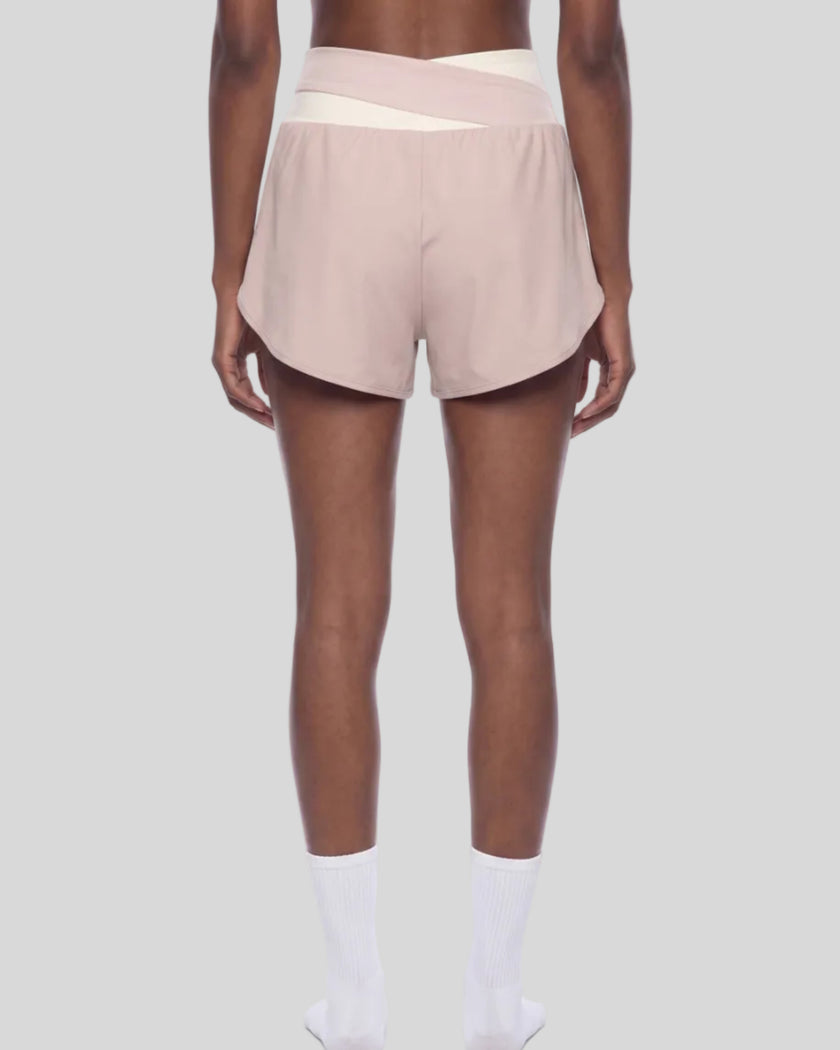 TrackLine Synergy Performance Shorts in Light Pink with Apricot color-block waistband, mid body back view
