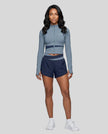 Woman wearing TrackLine Synergy Performance Shorts in Navy Blue with Gray Blue waistband, front view