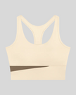 TrackLine Synergy Racerback Sports Bra in Apricot with Khaki color-block detail, front view