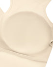 Interior chest pad detail of TrackLine Synergy Racerback Sports Bra in Apricot