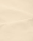 Close-up of stretch fabric on TrackLine Synergy Racerback Sports Bra in Apricot