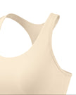 Angled close-up of TrackLine Synergy Racerback Sports Bra in Apricot with Light Pink detail
