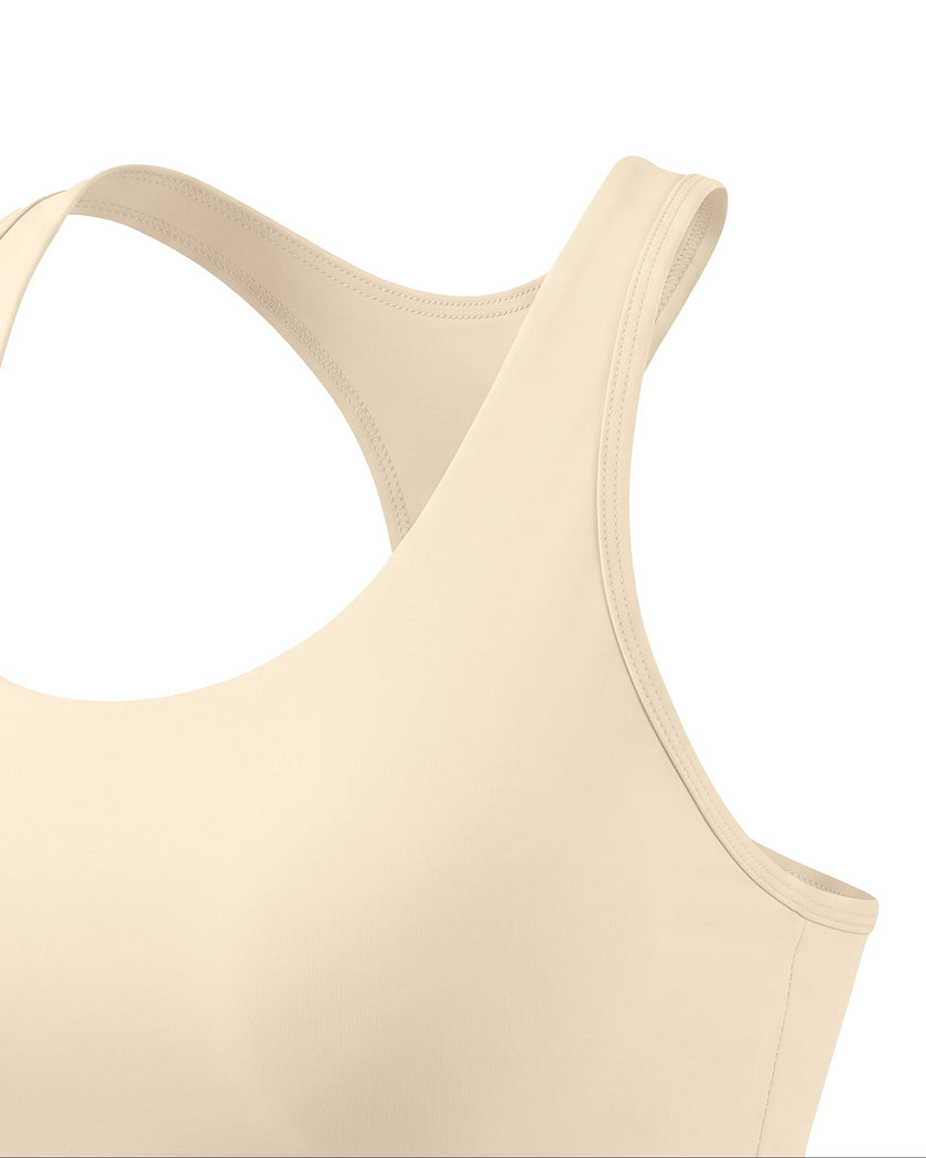 Angled close-up of TrackLine Synergy Racerback Sports Bra in Apricot with Light Pink detail