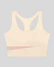 TrackLine Synergy Racerback Sports Bra in Apricot with Light Pink color-block detail, front view