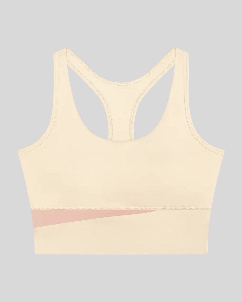 TrackLine Synergy Racerback Sports Bra in Apricot with Light Pink color-block detail, front view