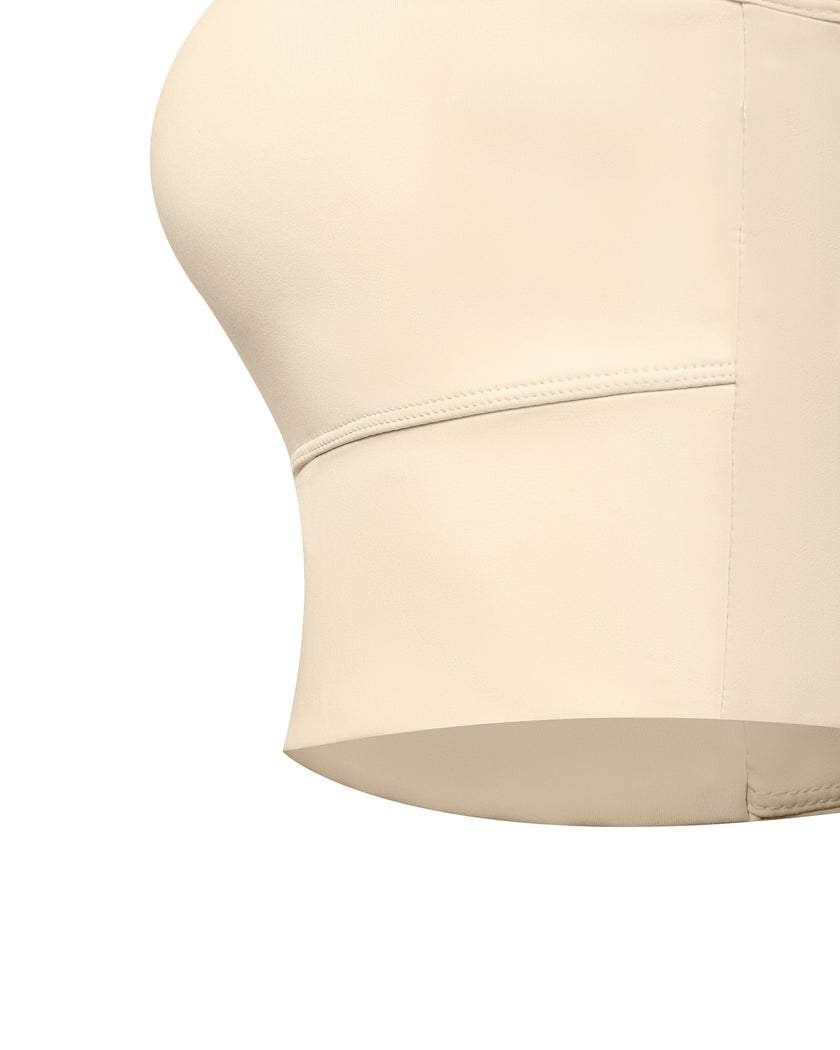 Close-up of asymmetric Light Pink underbust detail on TrackLine Synergy Racerback Sports Bra