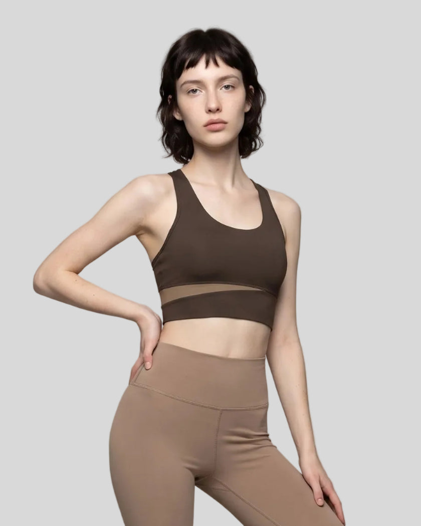 Woman wearing TrackLine Synergy Racerback Sports Bra in Coffee with Khaki detail, front view
