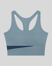 TrackLine Synergy Racerback Sports Bra in Gray Blue with Navy Blue color-block detail, front view