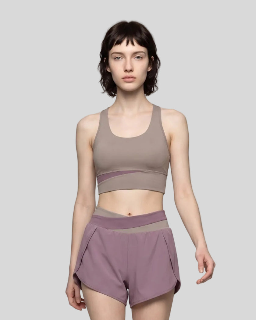 Woman wearing TrackLine Synergy Racerback Sports Bra in Gray Purple with Misty Purple detail, front view