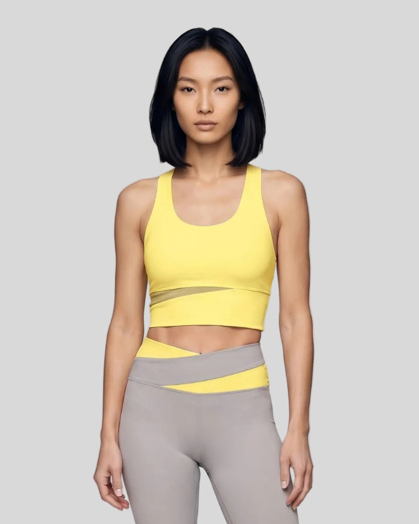 Woman wearing TrackLine Synergy Racerback Sports Bra in Lemon Yellow with Light Gray detail, front view