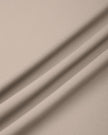 Close-up of smooth stretch fabric on TrackLine Synergy Skirted Leggings in Light Coffee