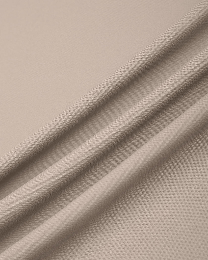 Close-up of smooth stretch fabric on TrackLine Synergy Skirted Leggings in Light Coffee