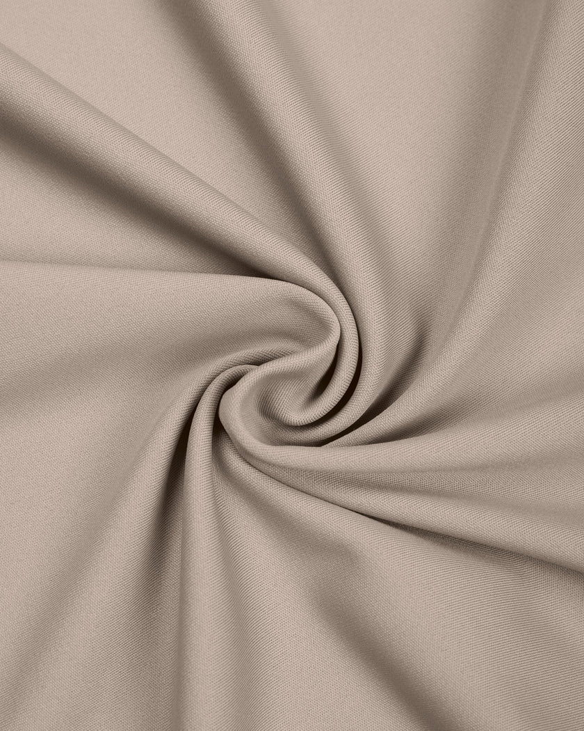 Detailed view of stretch knit construction on TrackLine Synergy Skirted Leggings in Light Coffee