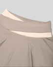 Close-up of high-rise crossover waistband on TrackLine Synergy Skirted Leggings in Light Coffee and Apricot